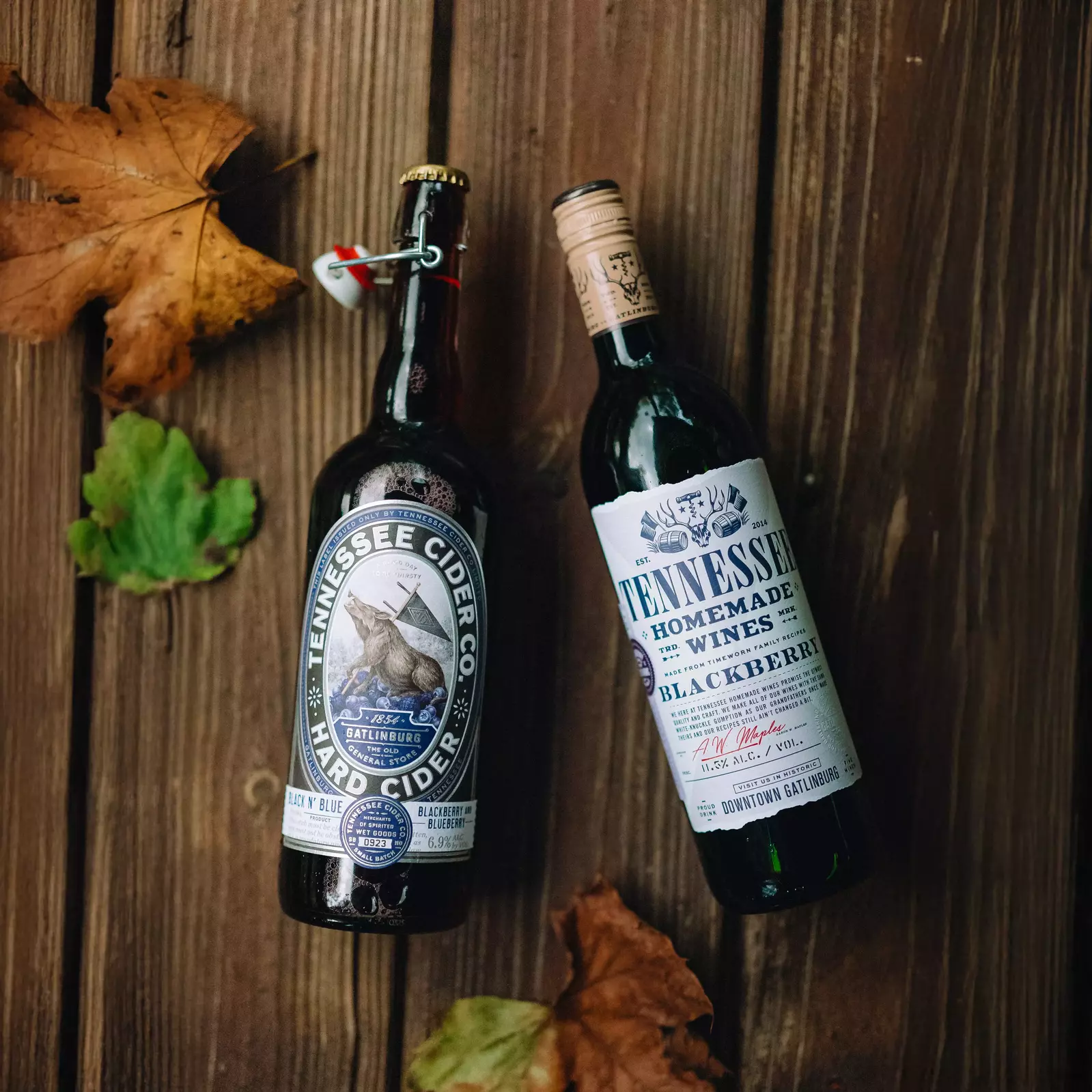 bottle of Tennessee Cider Co Black N Blue hard cider and Tennessee Homemade Wines Blackberry Wine